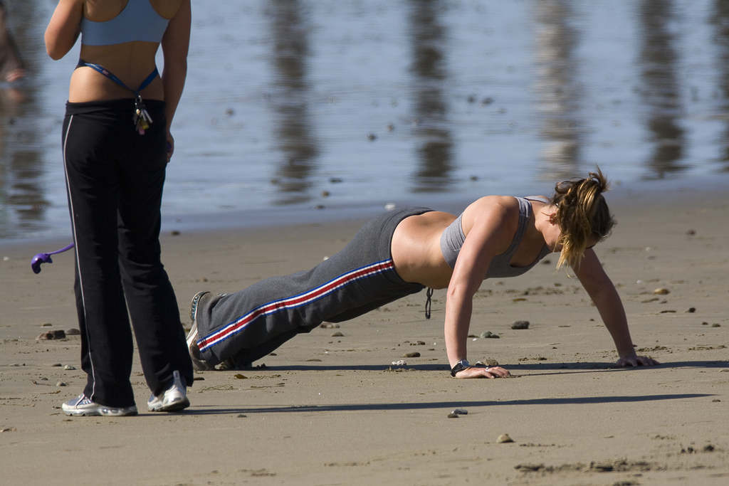 two-girls-exercising-cayucos-beach1 by Mike Baird